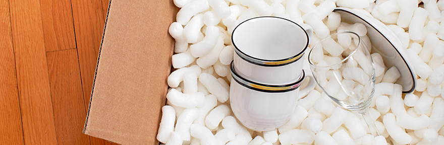 Box with packaging peanuts and china tea cups
